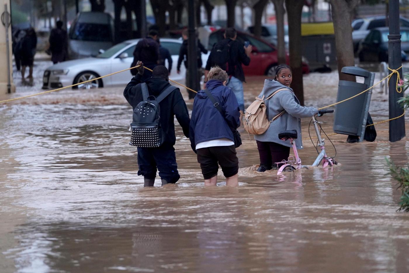 At least 63 people die in devastating flash floods in eastern Spain, officials say