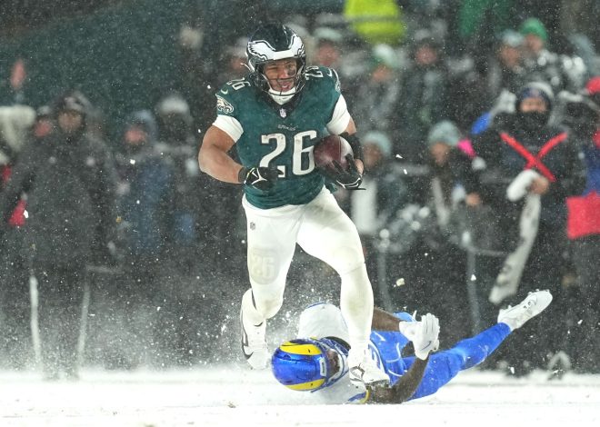 Barkley runs for 78- and 62-yard TDs in the snow and Eagles top Rams 28-22 to head to NFC title game