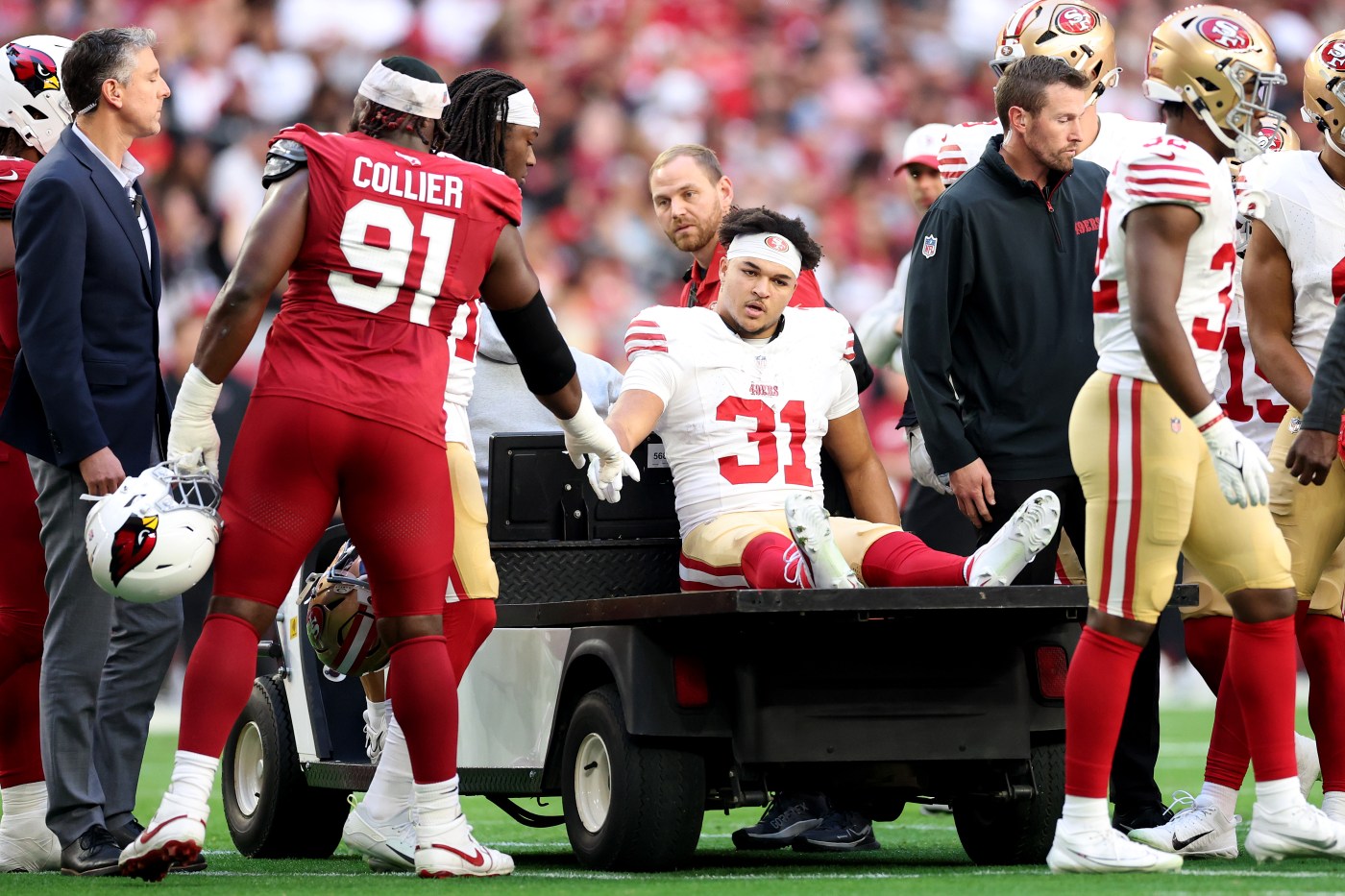 49ers running back Isaac Guerendo carted off with leg injury