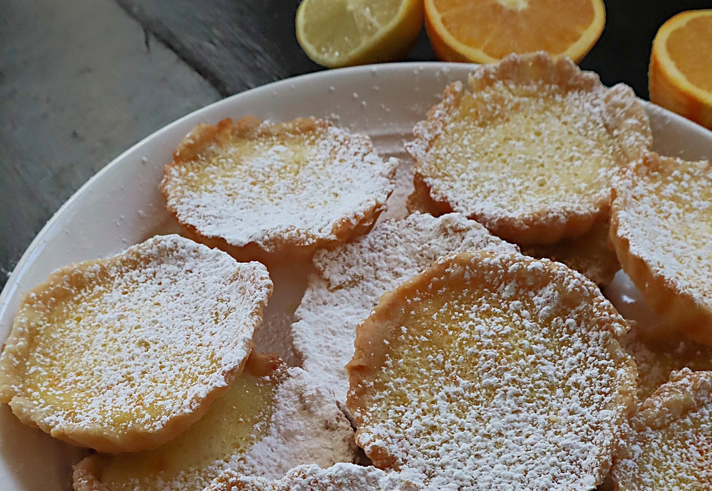 Citrus tartlets combine tangy lemon and orange bites in a buttery pastry