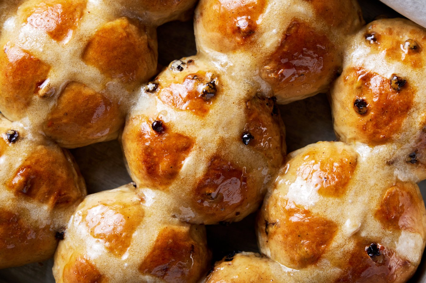 Bourbon-plumped currants enhance the flavor of hot cross buns